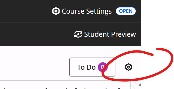 upper right of gradebook page, gear icon circled